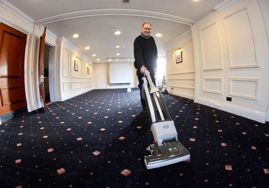 Paul Dyson vacuuming
