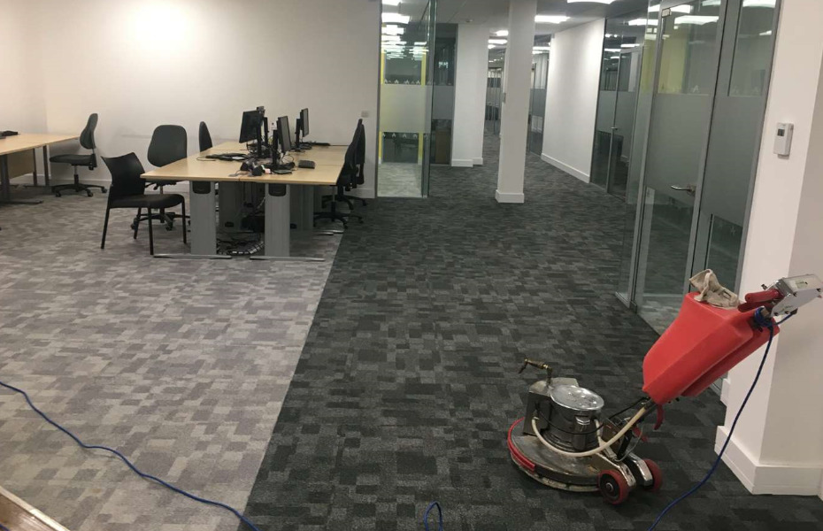 Commercial carpet maintenance cleaning in an office.