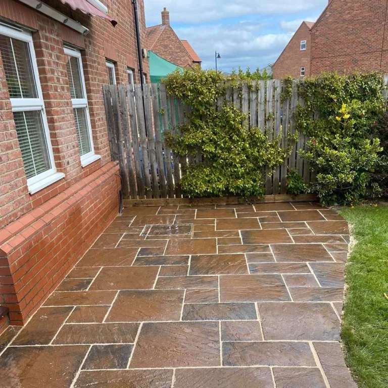 A completed patio sealing project featuring vibrant, multi-toned paving slabs.