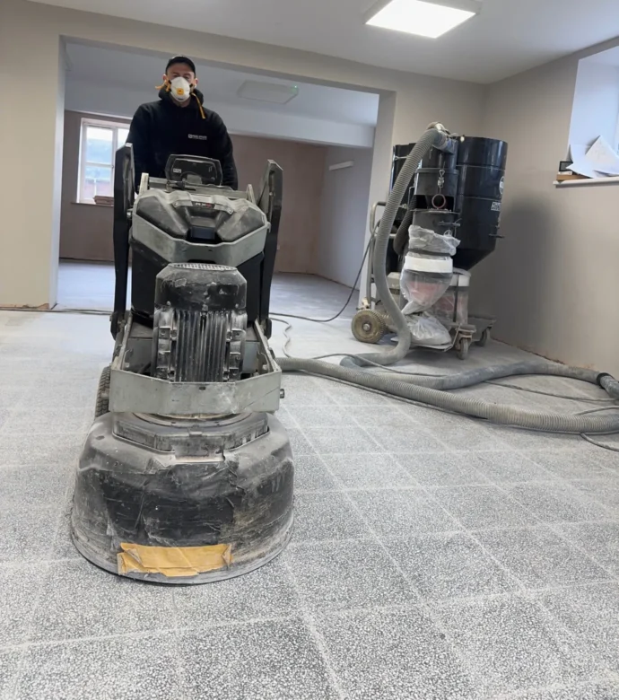 Natural stone floors receiving a grinding treatment.