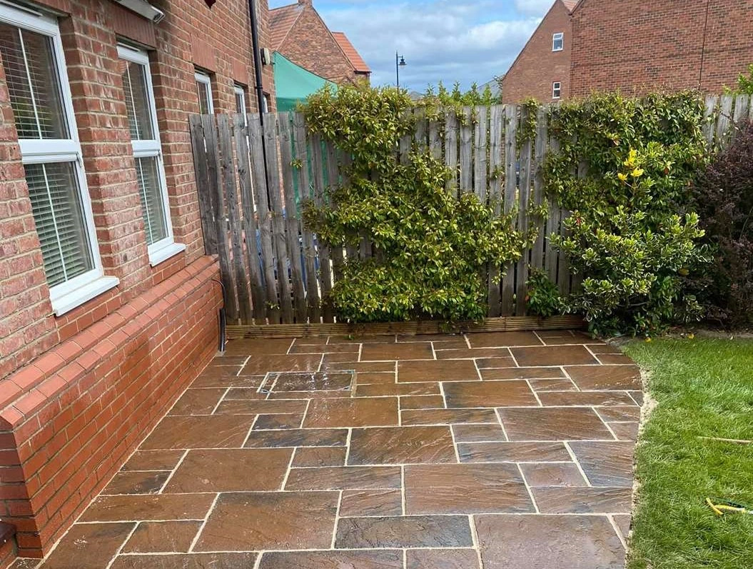 A freshly cleaned and repointed natural stone patio.